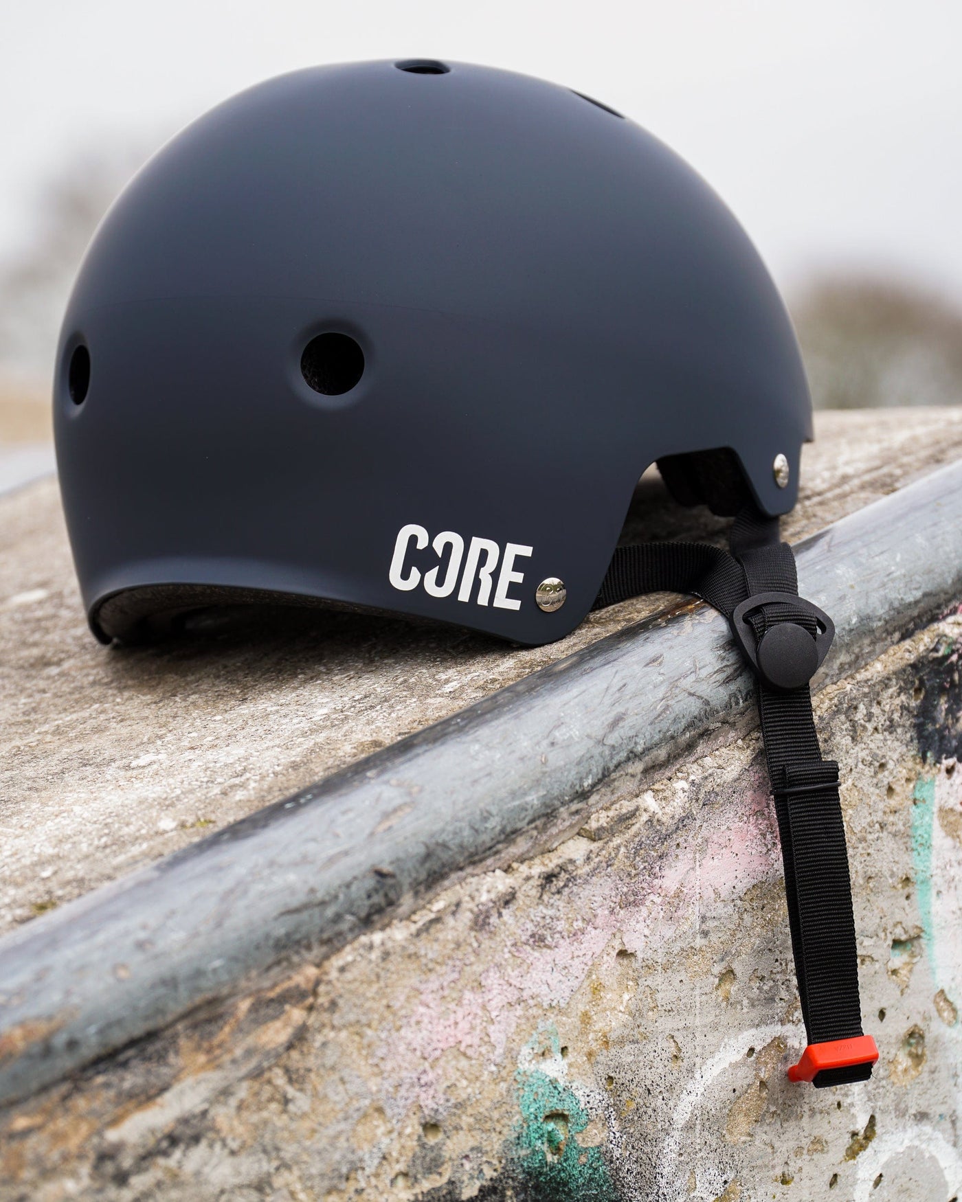 CORE Action Sports BMX Helmet Grey I Skateboard Helmet Zoomed Out Skatepark