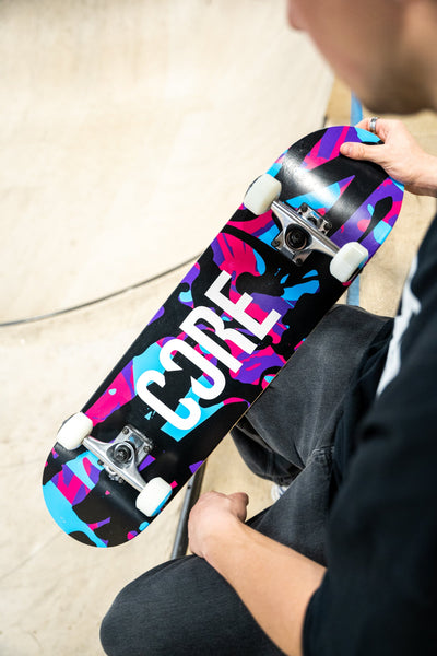 CORE Complete Skateboard Neon Splat C2 I Complete Skateboard Holding