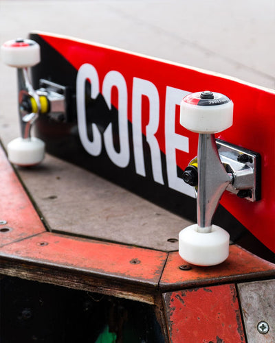 CORE Complete Skateboard Red Scratch C2 I Complete Skateboard Laying on Side
