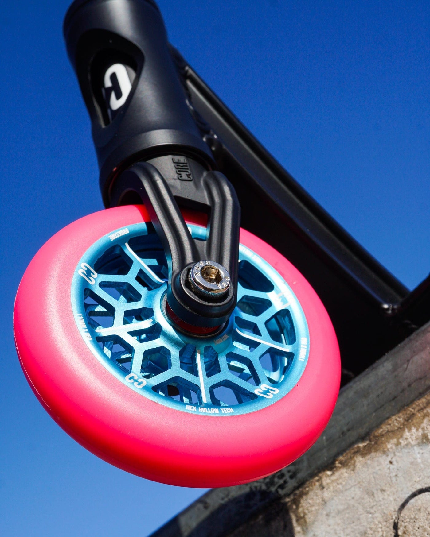 CORE Hex Hollow Stunt Pink & Blue Scooter Wheel 110mm I Scooter Wheel Angled Attached