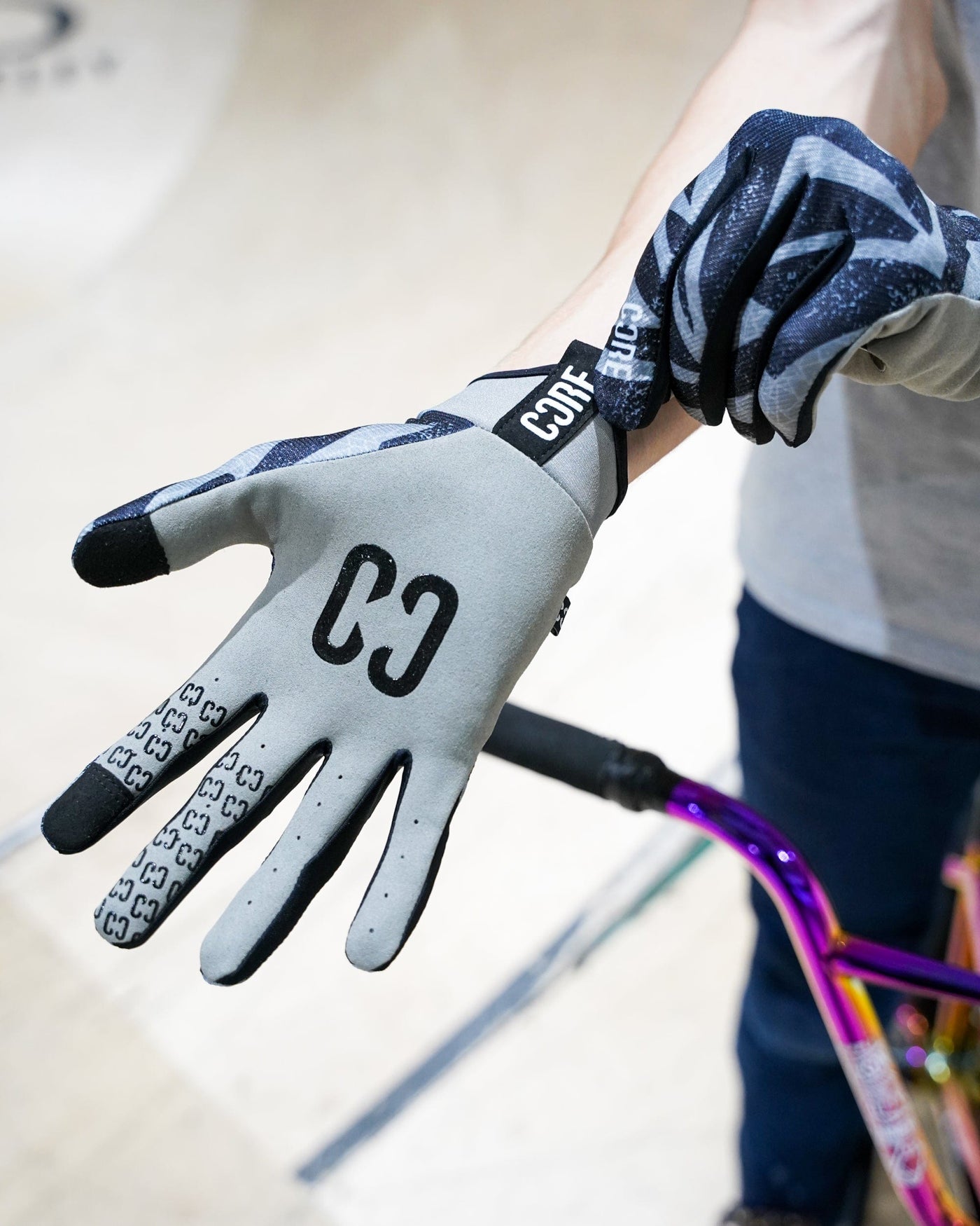 CORE Protection Aero BMX Gloves Zag I Bike Gloves Alt Putting Product On