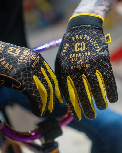 CORE Protection BMX Gloves SR Black Gold Geo I Bike Gloves Zoomed in Logo