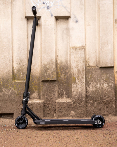 CORE ST2 Stunt Scooter Black I Adult Stunt Scooter Leaning
